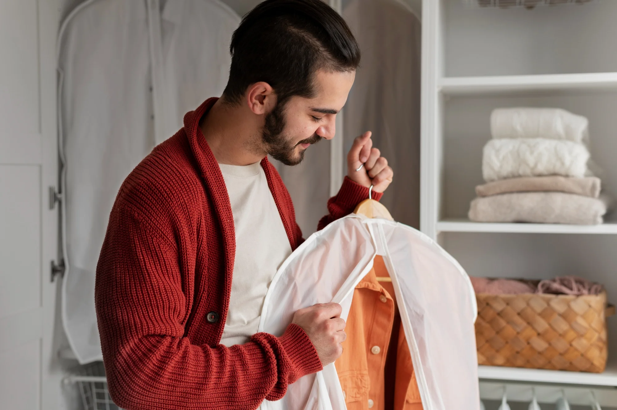 A man pulls a protective cloak over his clothes